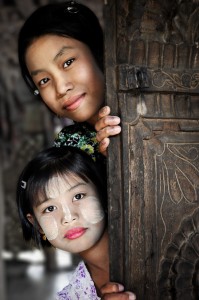 Two Faces Behind a Teak Door